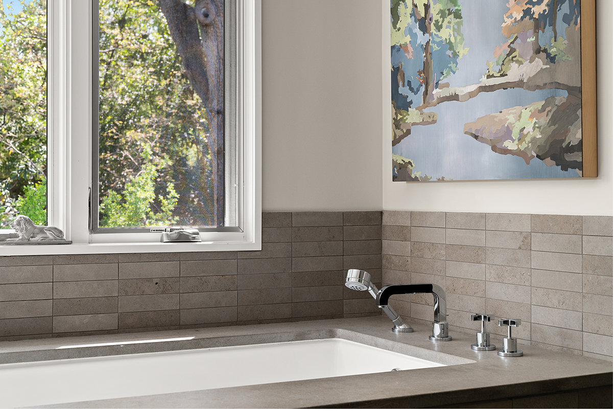 Bath detail with limestone and curated objects