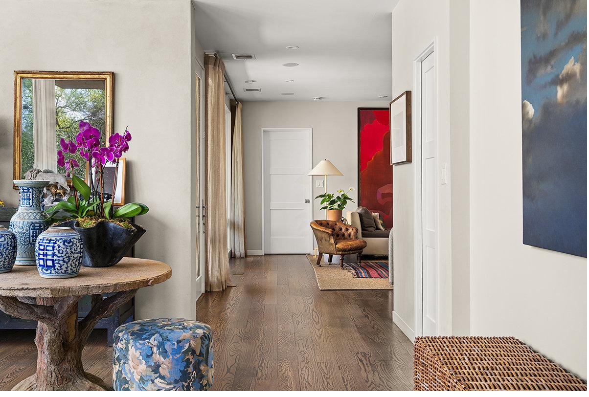 Entry foyer with hardwood floors and orchids