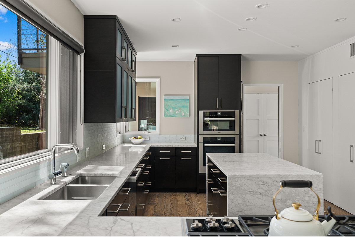 Kitchen island with marble waterfall edge