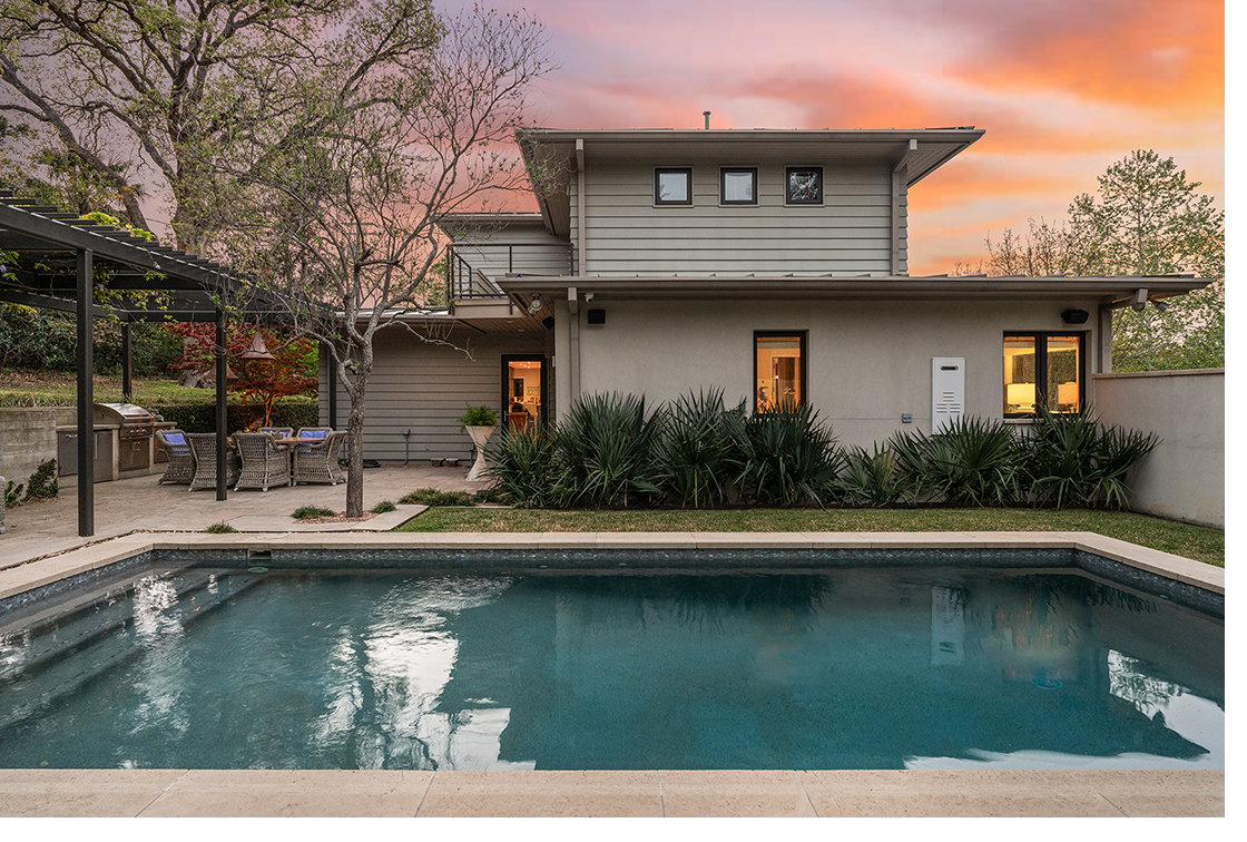 Pool terrace at twilight with sunset sky over Tarrytown