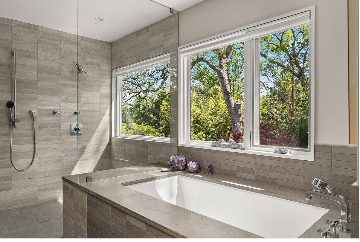 Primary bath with limestone and deep soaking tub